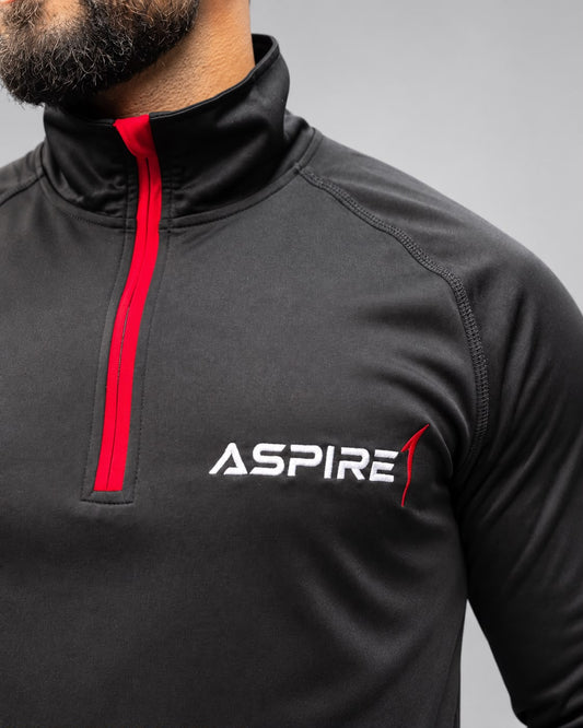Aspire1 1/4 Zip chest detail — embroidered logo and red zip