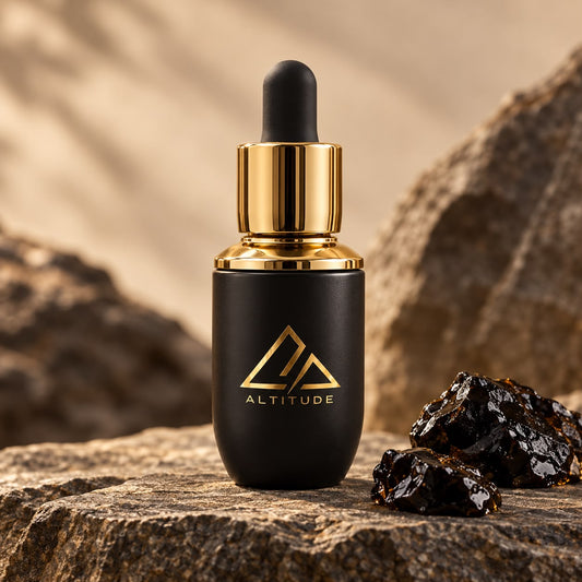 Altitude Shilajit Liquid dropper bottle beside raw shilajit resin
